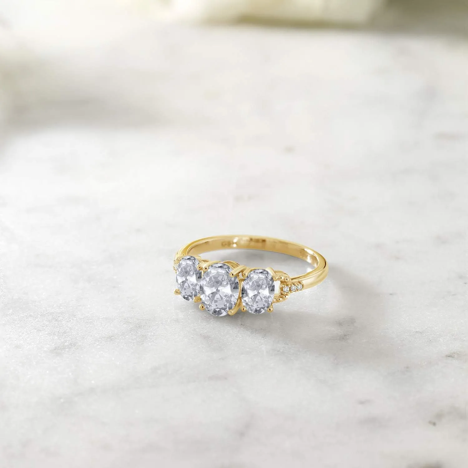 Gem Stone King 10K Yellow Gold White Topaz and Diamond 3-Stone Engagement Ring For Women |2.22 Cttw | Gemstone Birthstone | Oval 7X5MM and 6X4MM | Available In Size 5, 6, 7, 8, 9